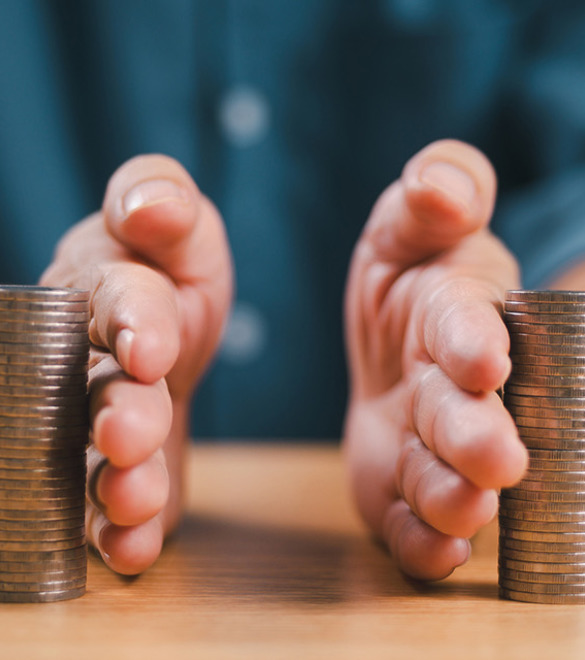 Divorce law and inheritance separation concept. Hand separate saving money, finance, home loan, debt return with piggybank and wood house. Bank business investment. Man separate stack coin on table