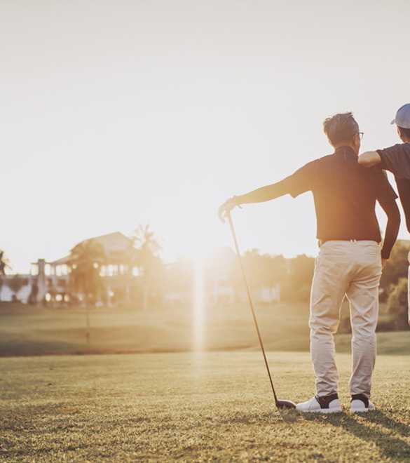 an asian chinese senior man golfer carrying his golf club on his shoulder and looking at the view in golf course